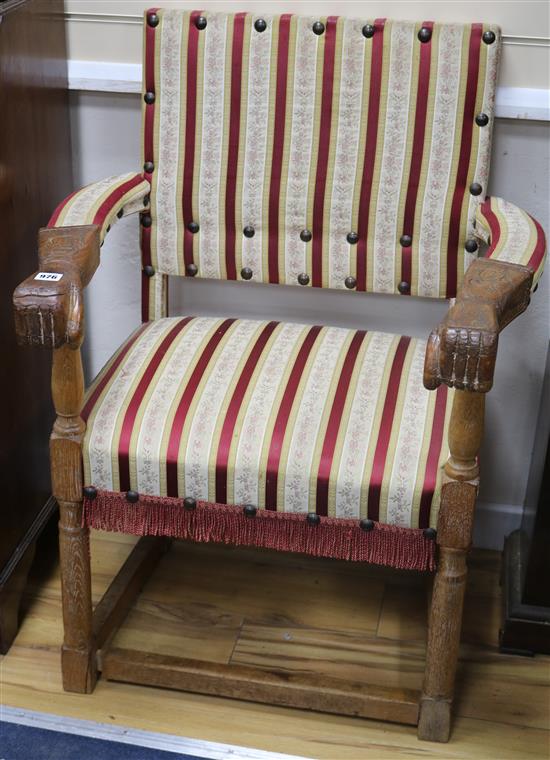 A pair of armchairs with hand mounts